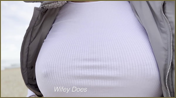 Braless wife walks on the public beach